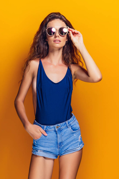 Woman wearing lingerie and sunglasses - Fotografie, Obrázek