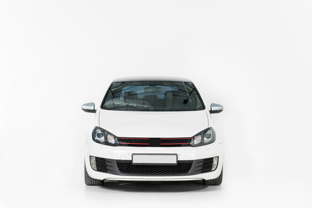 front view of one new white automobile on white - Foto, Imagem