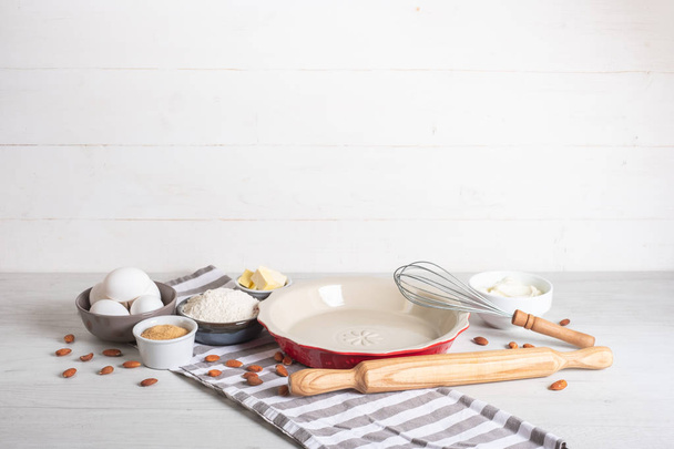 Baking ingredients and utensils on kitchen table - Foto, Imagem