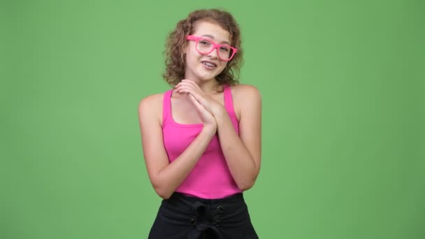 Young happy beautiful nerd woman clapping hands - Filmati, video