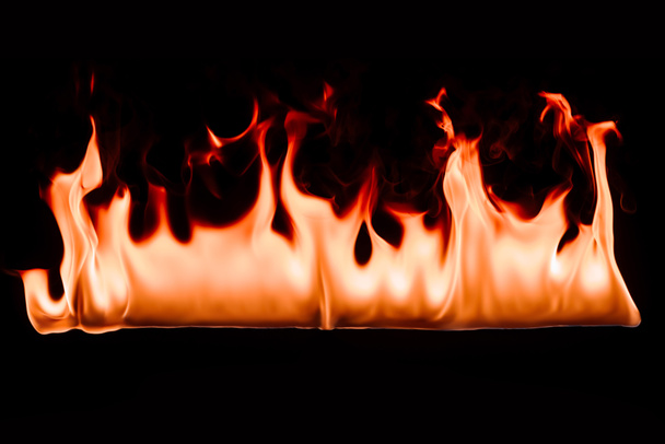 close up view of burning fire on black backdrop - Fotoğraf, Görsel