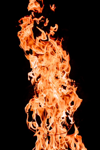 close up view of burning dollar sign isolated on black - Photo, Image