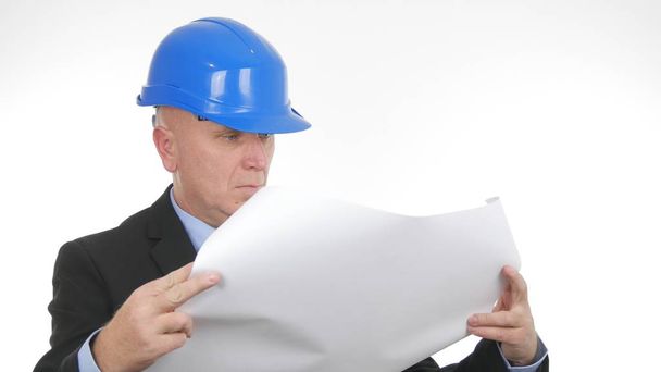 Engineer Image Reading a Construction Paper Plan - Valokuva, kuva