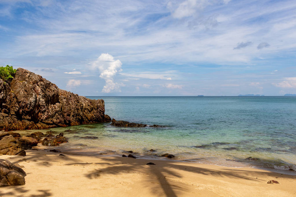 Krabi, Thailand - May 3, 2018: Hidden bay with gold sandy beach and palms on Lanta island - Fotó, kép