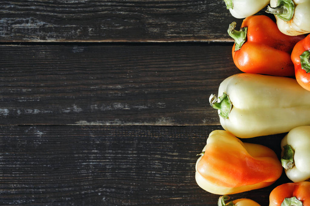 Red and yellow peppers on dark background - Photo, Image