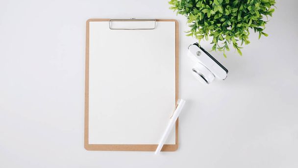 Top view of blank white paper note. Minimal flat lay style. - Photo, Image
