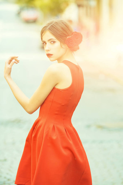 beauty woman in stylish red dress walking on road - Valokuva, kuva