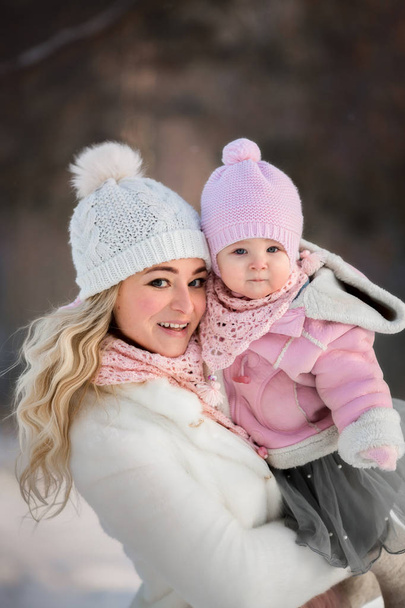 Beautiful Mother and daughter winter portrait  - Photo, Image