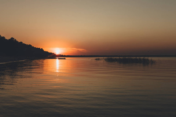 lake sunset with sun reflection - 写真・画像