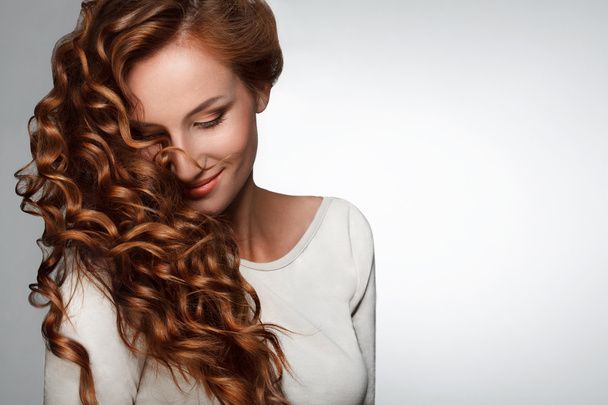 Red Hair. Woman with Beautiful Curly Hair - Zdjęcie, obraz