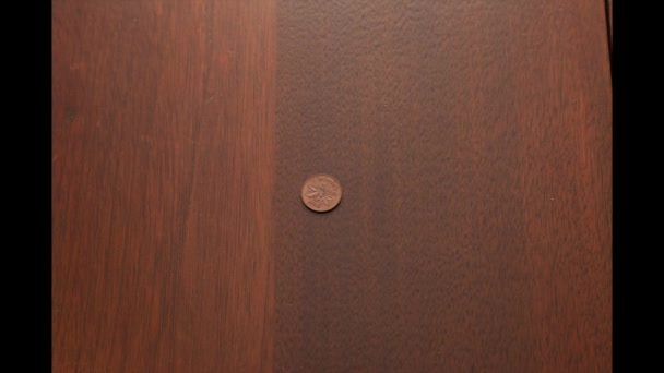 Starting with a penny, a pile of coins grows into a bigger pile of change  - Footage, Video