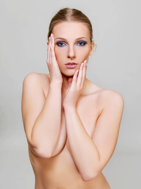 Attractive blonde topless woman with dark eye make up - Zdjęcie, obraz