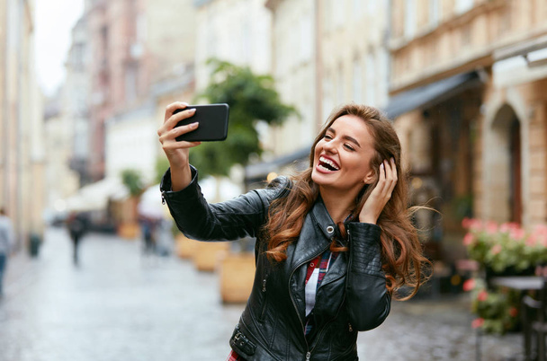 Woman Video Calling On Phone On Street, Taking Photos  - Foto, immagini