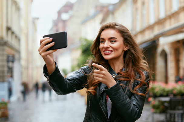 Woman Video Calling On Phone On Street, Taking Photos  - Фото, изображение