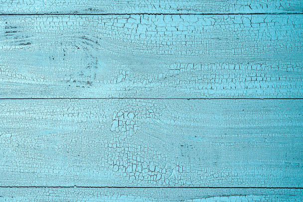 Közelkép kép természetes régi fa felület festett kék befest-val pattint. Textúrázott háttérre vízszintes elrendezés és másol hely. Nézd meg felülről. - Fotó, kép