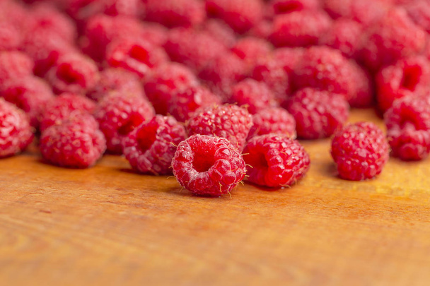 Raspberry fresh and sweet on wooden background close up - Foto, Imagem
