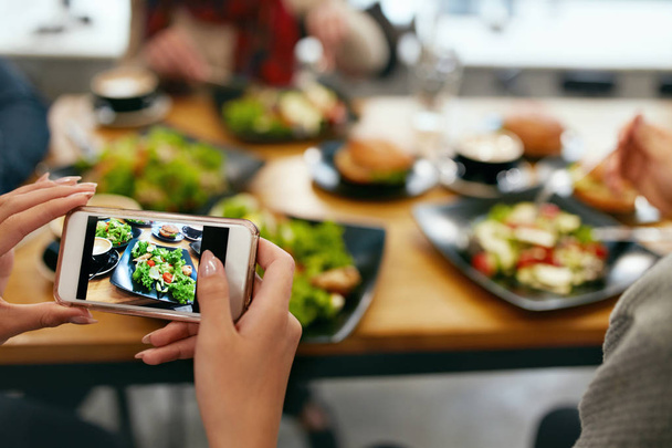 Photo On Phone. Closeup Woman Hands Photographing Food - Foto, immagini
