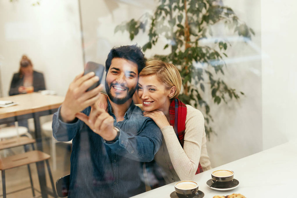 Happy People Using Phone In Cafe, Taking Photos - Valokuva, kuva