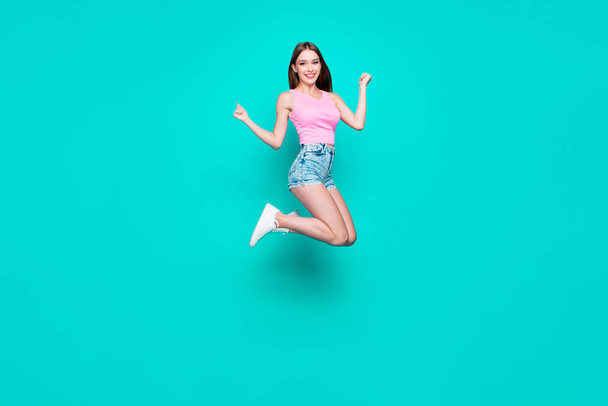 Full-body portrait of happy young brunette student girl with leg - Photo, image