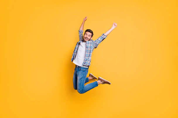 Full-size portrait of happy excited young man screaming and jump - Фото, зображення