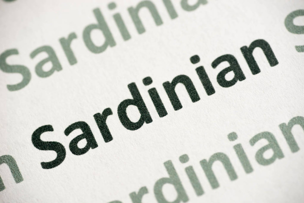 word sardinian  language printed on white paper macro - Photo, Image