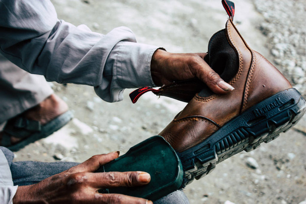 Kathmandu Nepal August 22, 2018 Closeup of a Nepali shoe polisher working  at Thamel street in Kathmandu in the morning - Zdjęcie, obraz