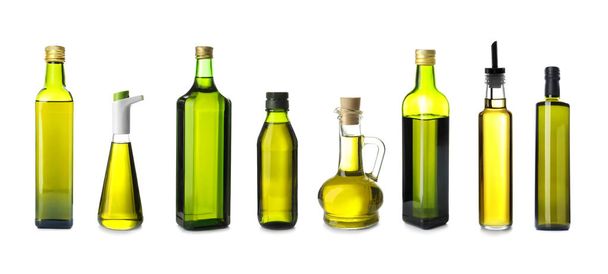 Different bottles with olive oil on white background - Photo, Image