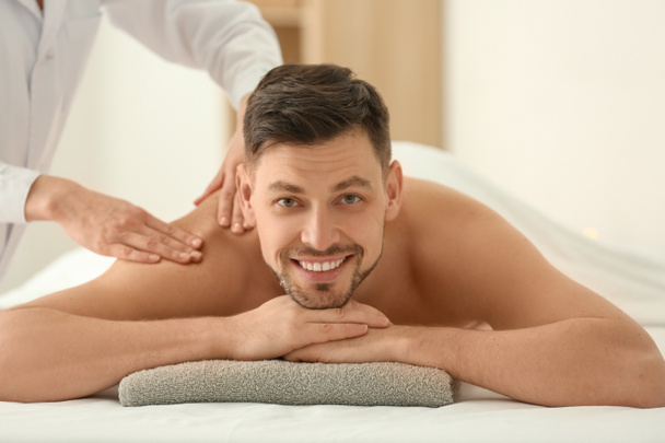 Man having massage in spa salon - Photo, image