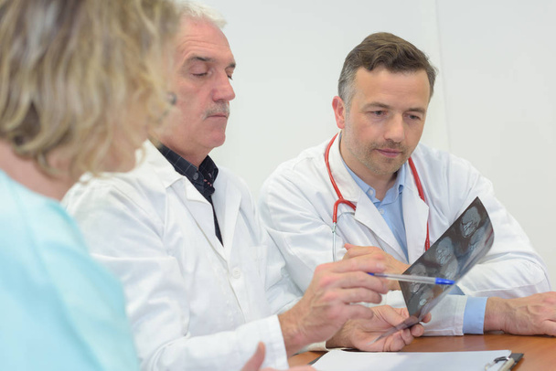 doctors looking at x-ray - Photo, Image