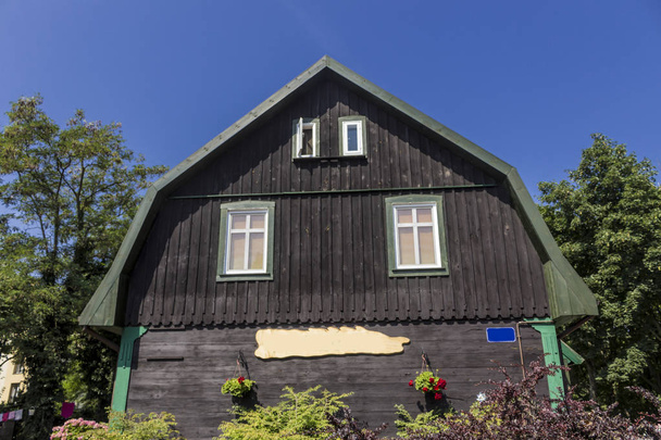 Renovated wooden house with black walls. The beginning of the twentieth century. The resort town of Krynica Morska (Kalberg). Coast of the Baltic Sea. - Photo, Image