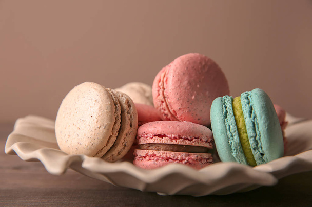 Plate with tasty macarons on table - Foto, Imagem
