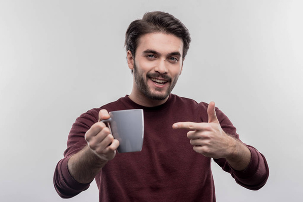 Happy bearded man feeling amazing drinking his morning coffee - Foto, Imagen