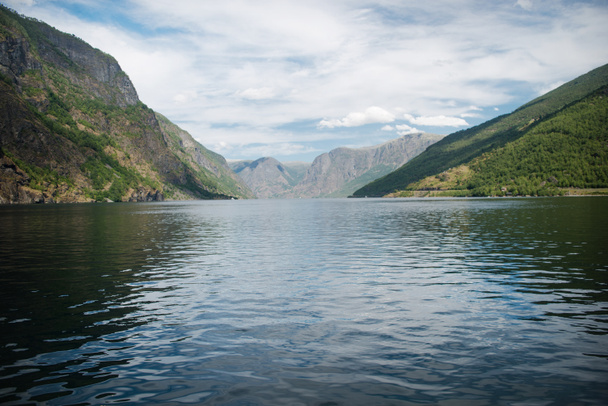 beautiful landscape with majestic mountains and calm water of Aurlandsfjord, Flam (Aurlandsfjorden), Norway  - Foto, Bild