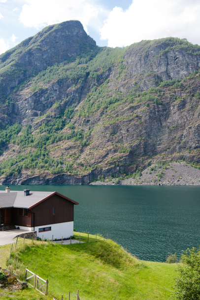 cozy wooden house on coast of beautiful Aurlandsfjord, Flam (Aurlandsfjorden), Norway - Zdjęcie, obraz