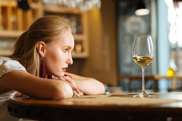 Sad young woman wanting to drink alcohol - Zdjęcie, obraz