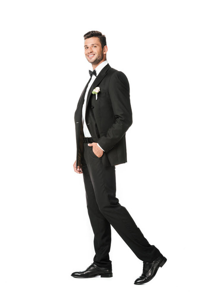 handsome young groom in stylish suit isolated on white - Foto, Imagen