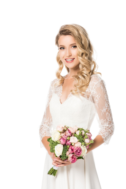 attractive young bride with bouquet looking at camera isolated on white - Foto, Imagem