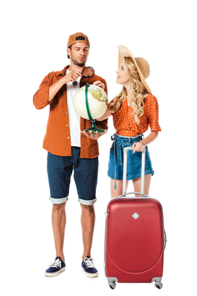 couple standing with globe and travel bag isolated on white - Photo, Image