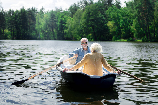 Couple of happy pensioners enjoying their amazing river trip - Fotó, kép