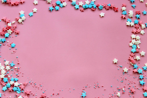 Sugar topping for cake, frame on a pink background, free space for text. The concept of the holiday, birthday. - Φωτογραφία, εικόνα