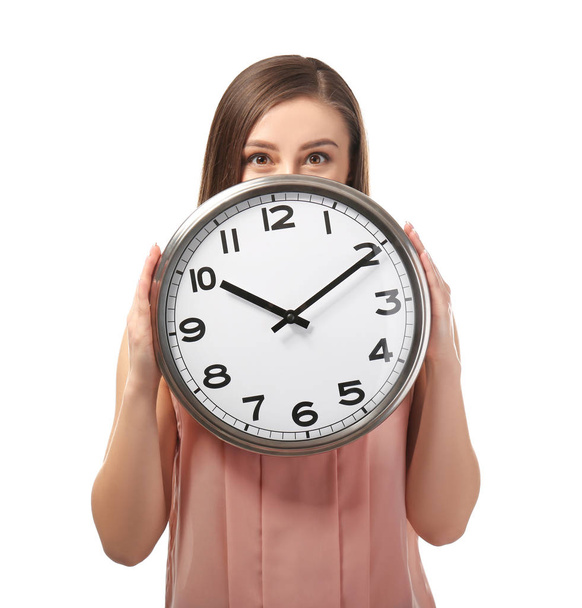 Young woman with clock on white background. Time management concept - Photo, Image