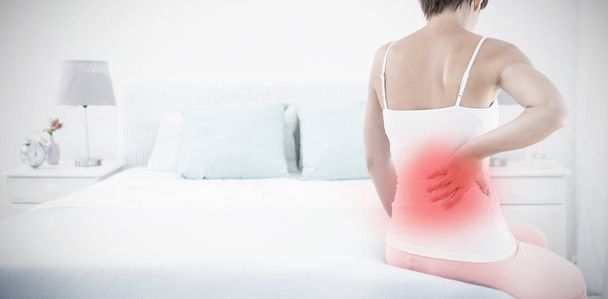 Highlighted pain against woman with back pain - Foto, Imagem
