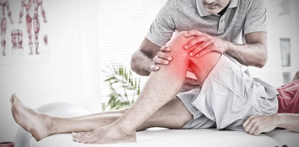 Highlighted pain against man having leg massage - Fotografie, Obrázek