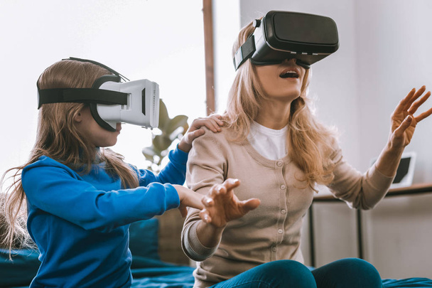 Nice young woman being in virtual reality - Photo, image