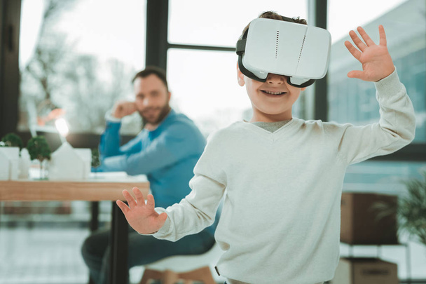 Joyful happy boy enjoying virtual reality - Photo, image