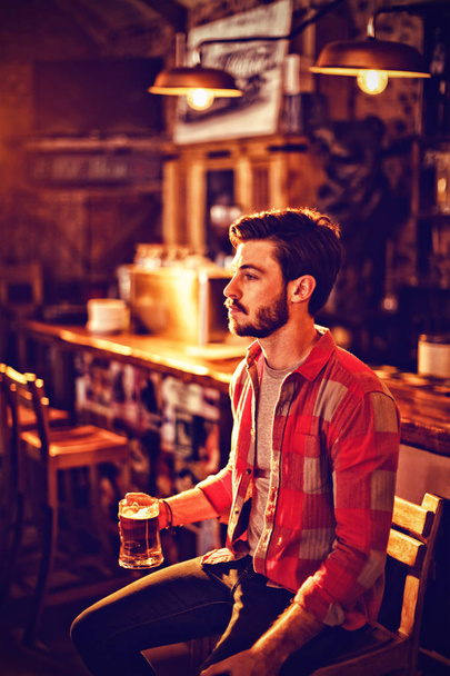 Thoughtful man having beer in bar - Φωτογραφία, εικόνα