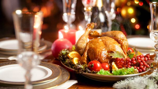 Closeup image of hot freshly baked turkey on family festive dinner - Photo, image