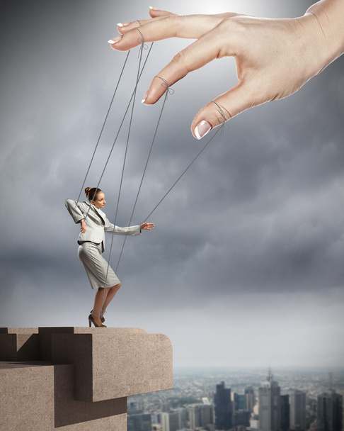 Business woman marionette - Foto, afbeelding