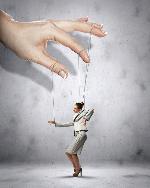 Business woman marionette - Foto, afbeelding
