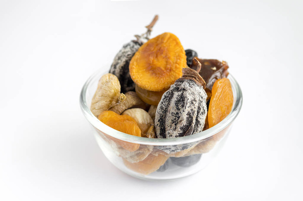 different kinds of nuts and dry fruits in a plate.Top view and c - Фото, изображение
